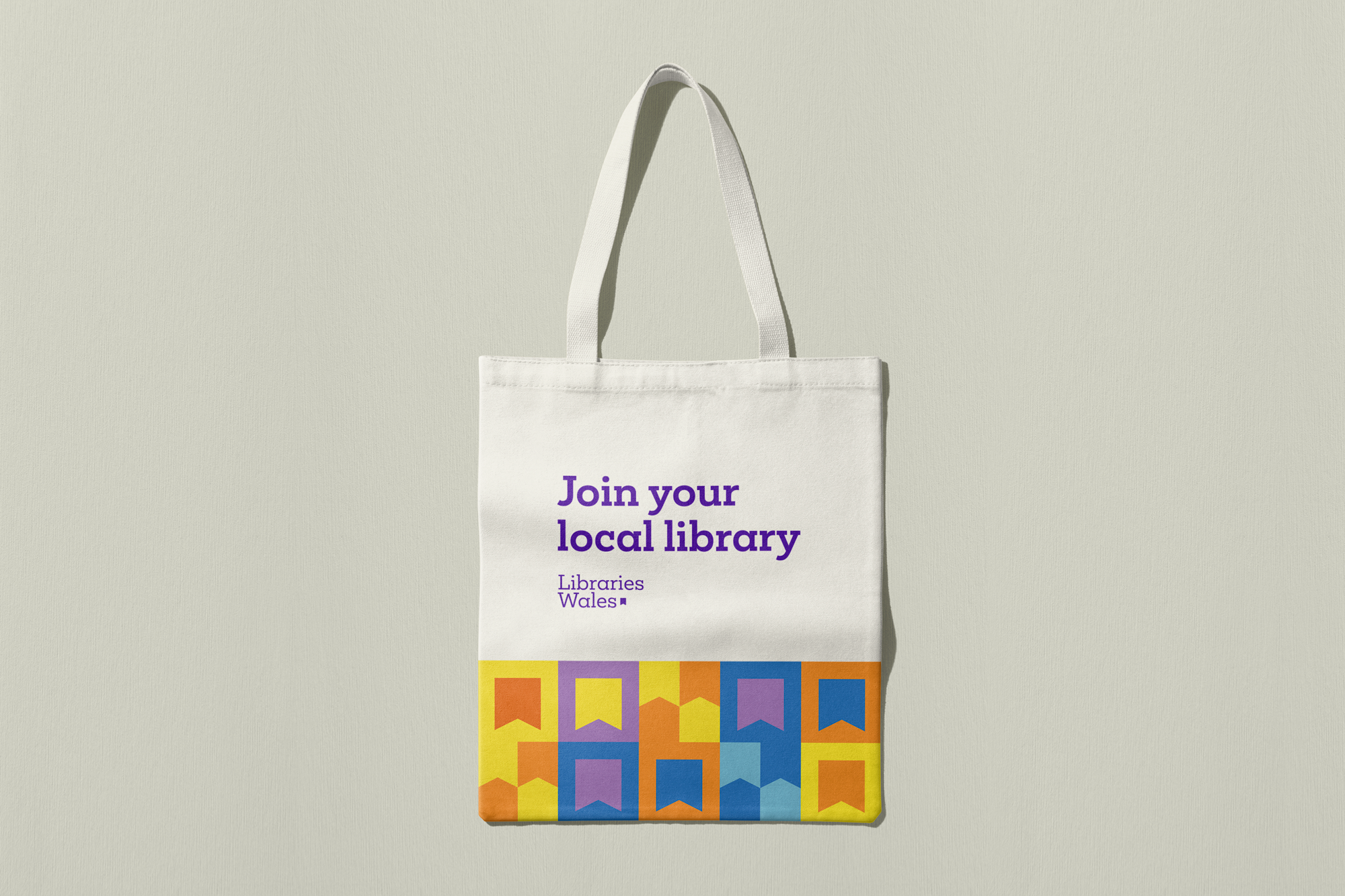 Libraries Wales branded tote bag with the words 'Join your local library'